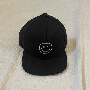 NWOT Black smiley face SnapBack